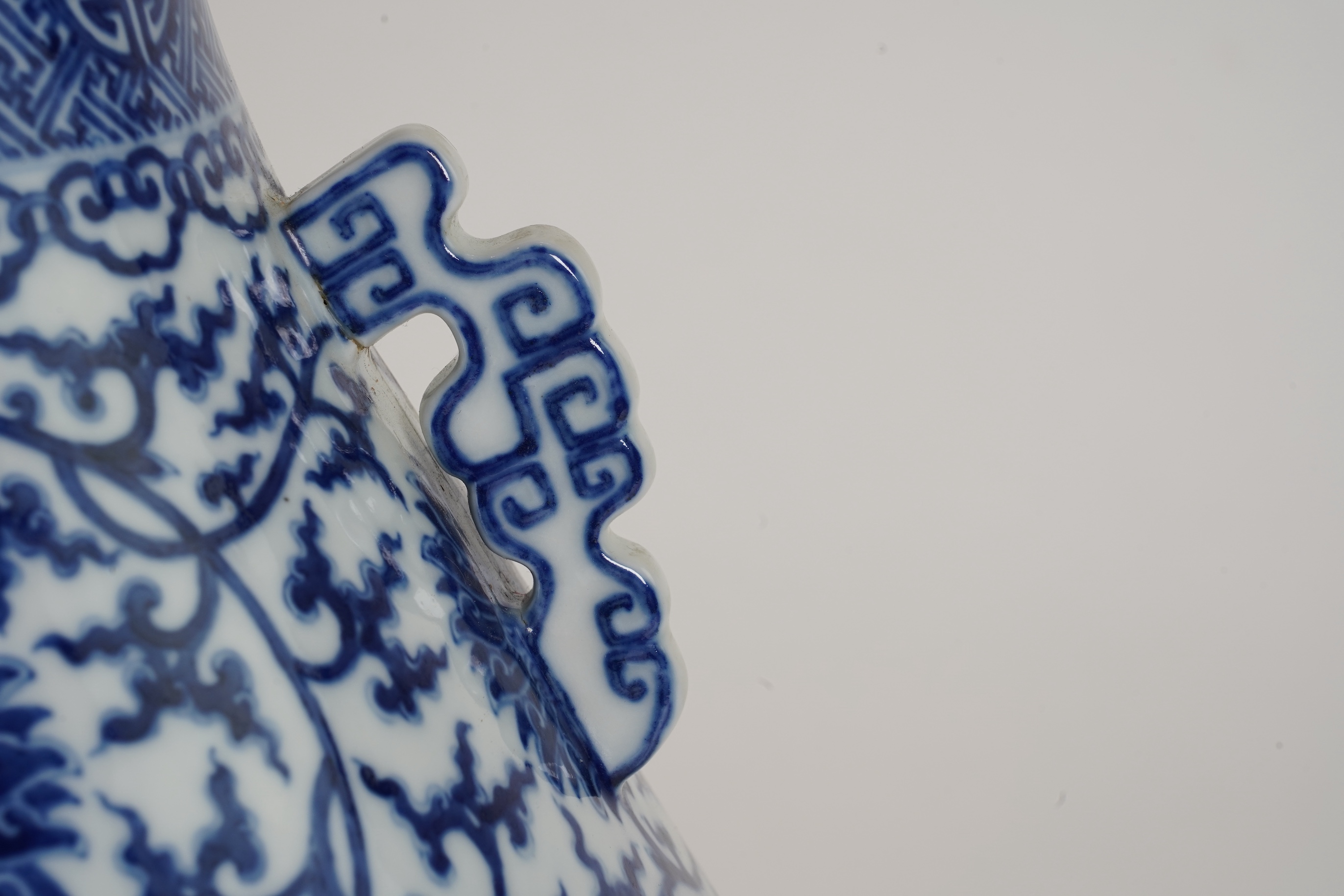 A large Chinese blue and white pear shaped vase, hu, Qianlong seal mark but later